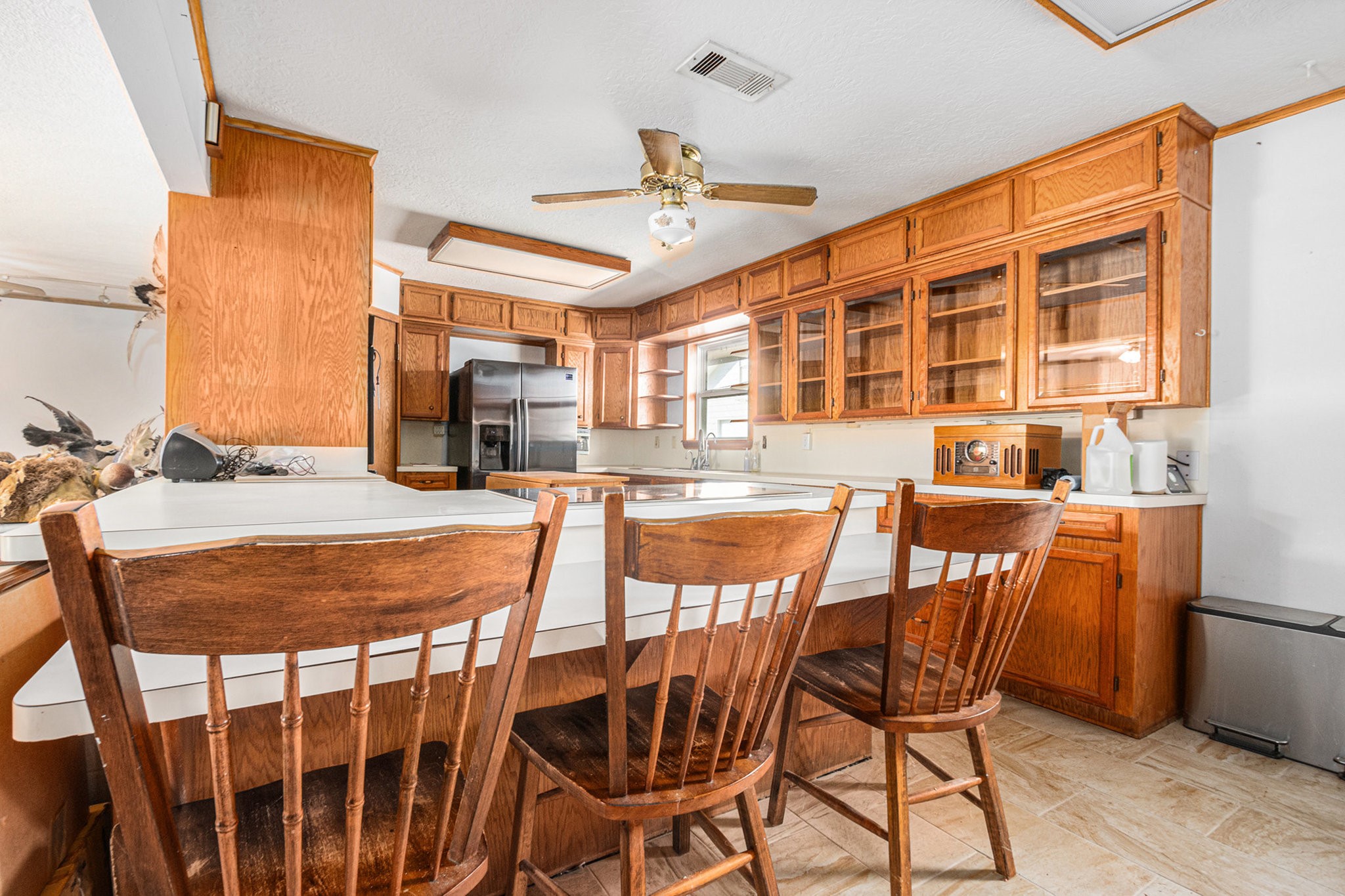 4709 Frontier Drive Houston, TX 77041 - Photo 11 of 20 a dining room with stainless steel appliances kitchen island granite countertop a dining table and chairs with wooden floor