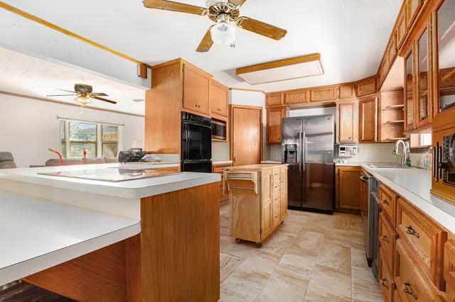 a kitchen with appliances cabinets and a sink