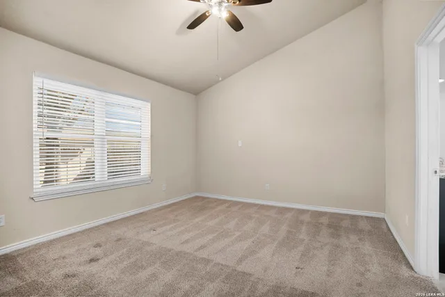a view of an empty room with a window