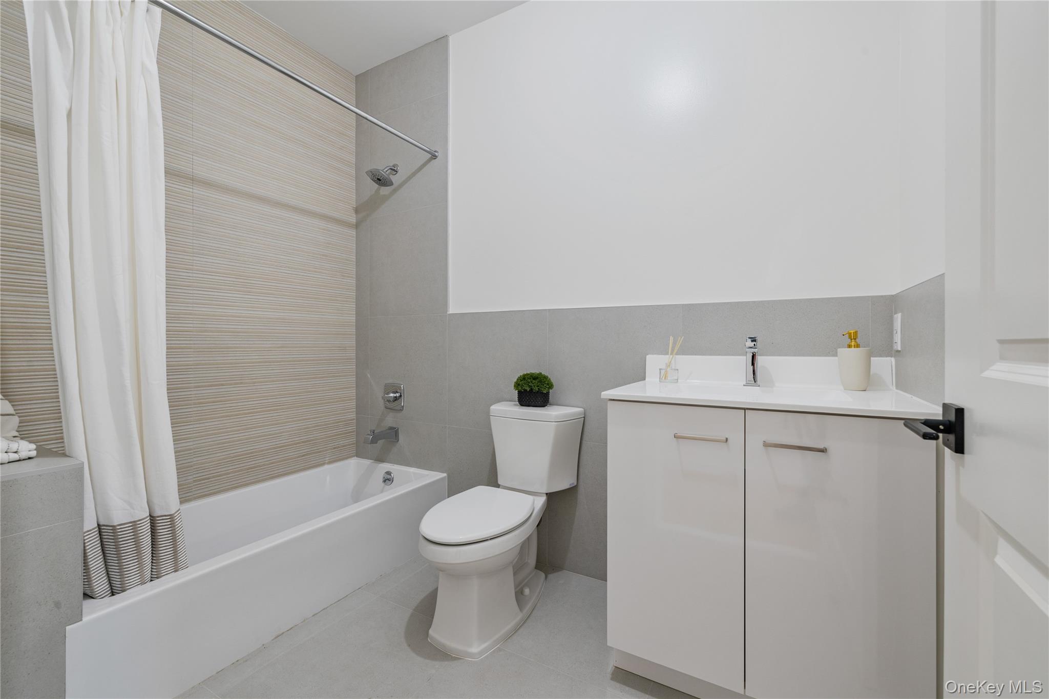 17 Union Road, Unit 110 Spring Valley, NY 10977 - Photo 11 of 16 a white toilet sitting next to a bath tub