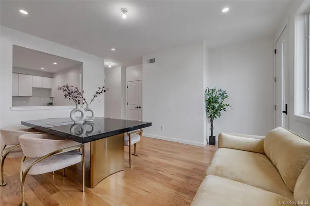 a view of a livingroom with furniture and a chandelier
