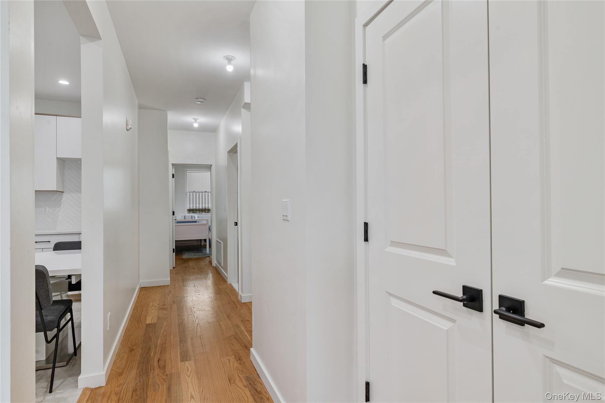 17 Union Road, Unit 110 Spring Valley, NY 10977 - Photo 5 of 16 a view of a hallway with wooden floor and a bathroom