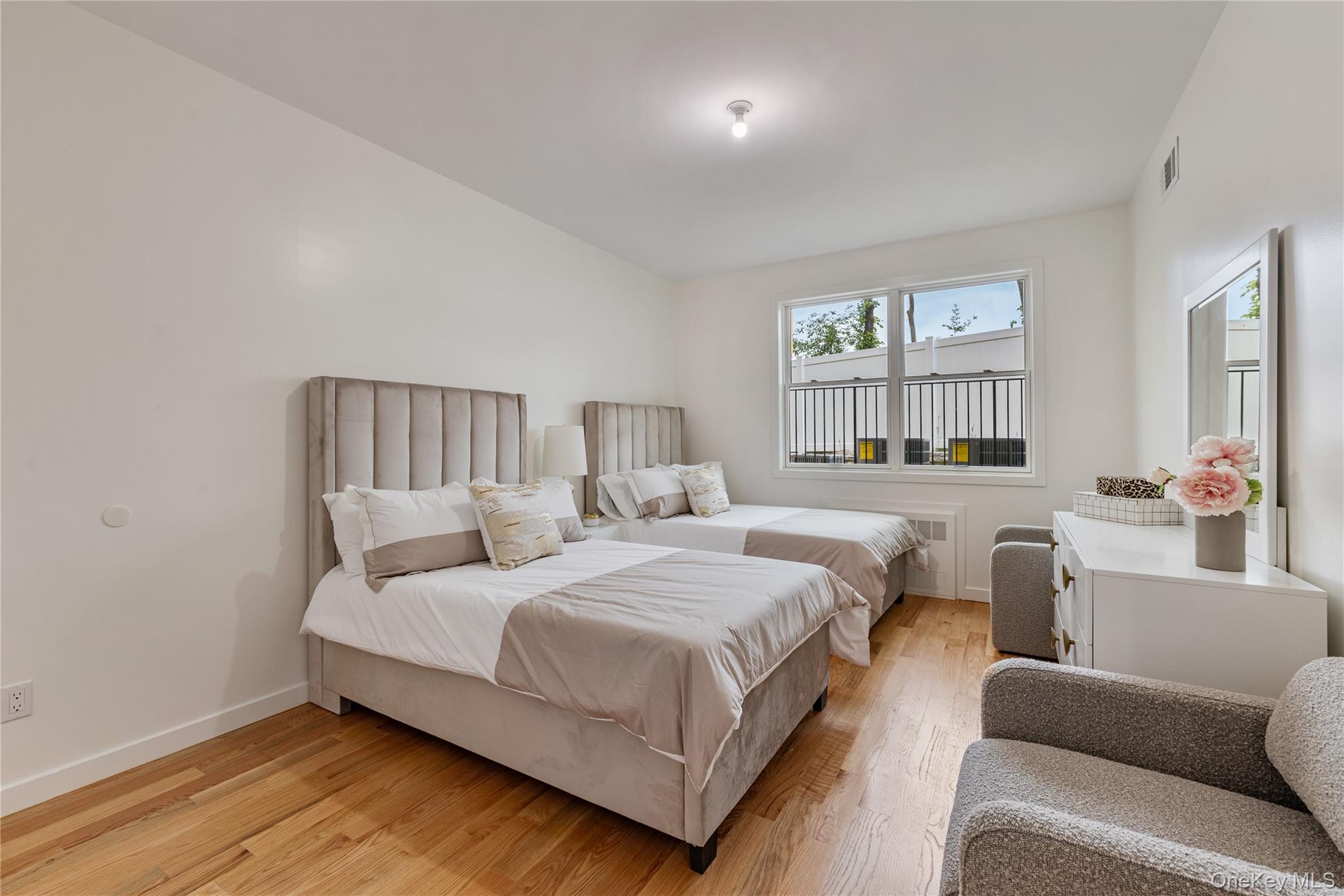 17 Union Road, Unit 110 Spring Valley, NY 10977 - Photo 9 of 16 a bedroom with a bed couch and a window