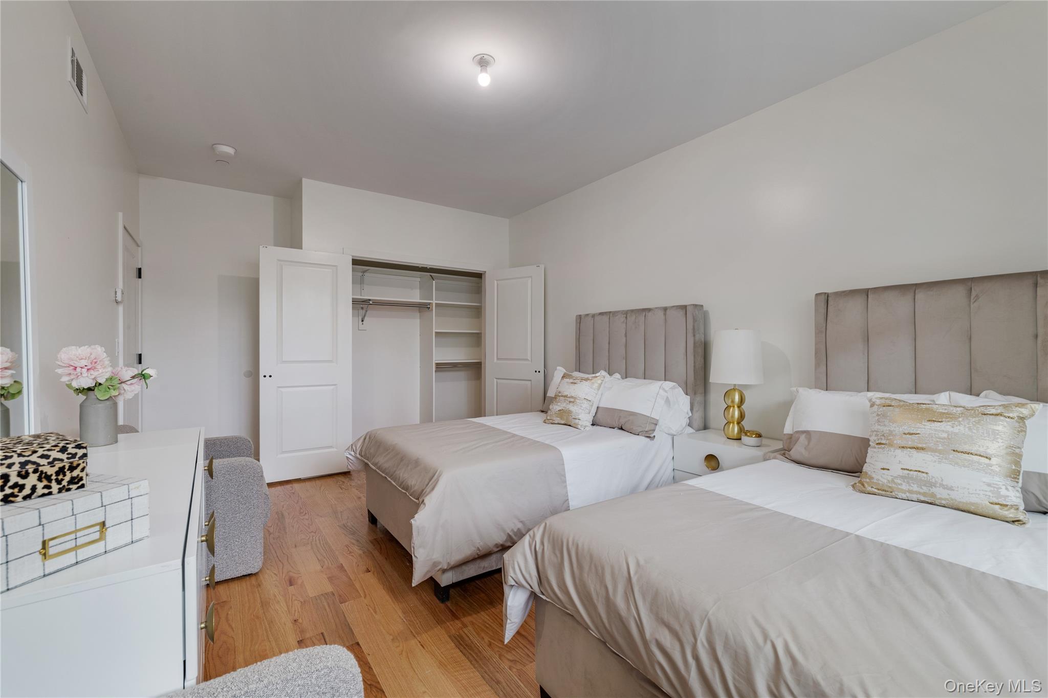 17 Union Road, Unit 110 Spring Valley, NY 10977 - Photo 10 of 16 a bedroom with two beds and a couch