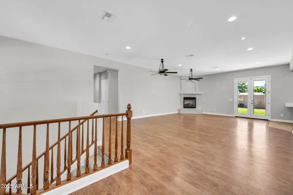 a large kitchen with stainless steel appliances granite countertop a refrigerator a sink and a stove