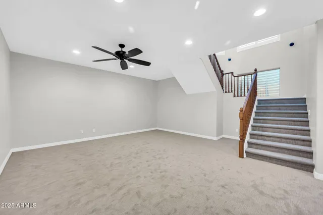 a view of empty room with wooden floor and fireplace