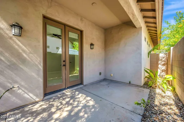 a view of an empty room with a ceiling fan