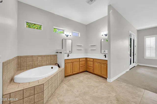 a bathroom with a shower and a glass door