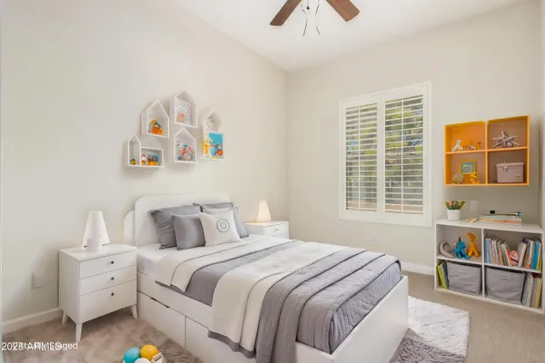 a view of a room with a ceiling fan