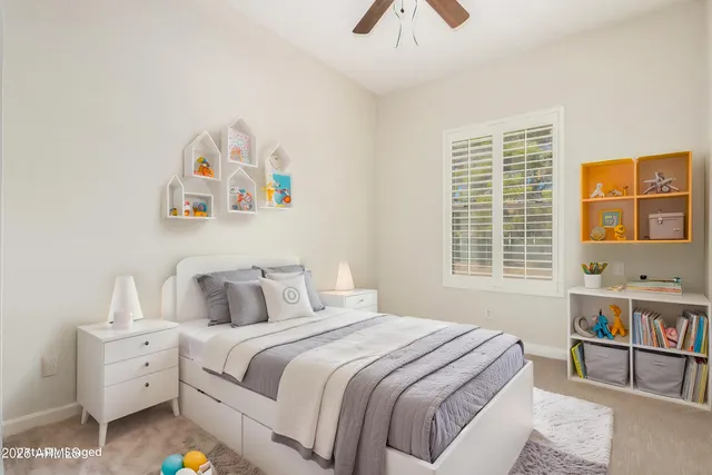 a view of a room with a ceiling fan