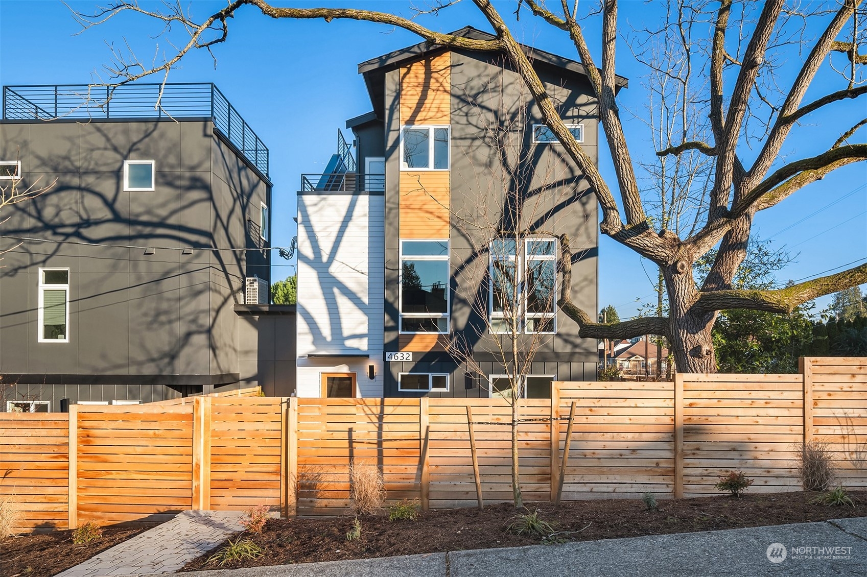 4632 49th Avenue South Seattle, WA 98118 - Photo 1 of 36 a view of a brick house with many windows