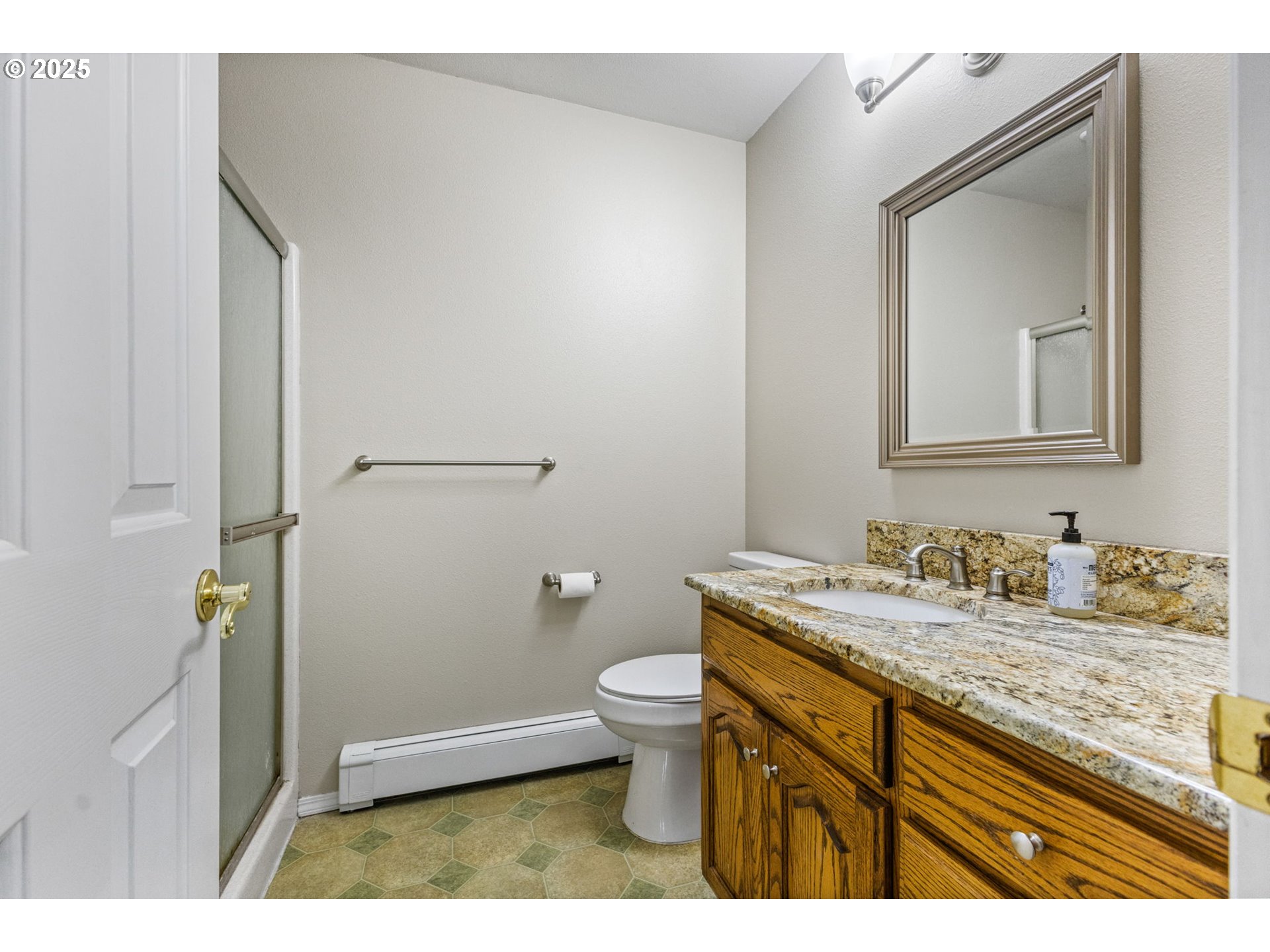 17576 North Abiqua Road Silverton, OR 97381 - Photo 15 of 40 a bathroom with a granite countertop sink a toilet and a mirror