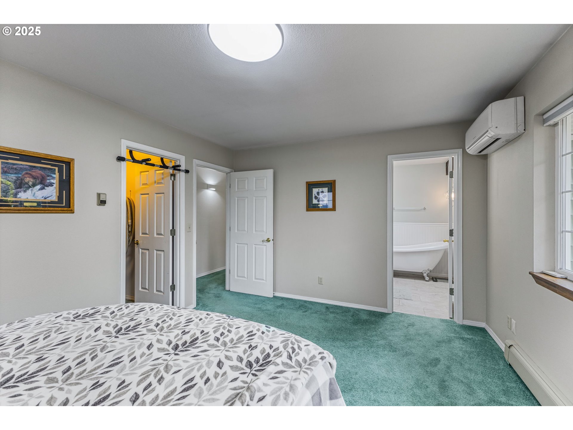 17576 North Abiqua Road Silverton, OR 97381 - Photo 19 of 40 a bedroom with a bed and a painting on the wall