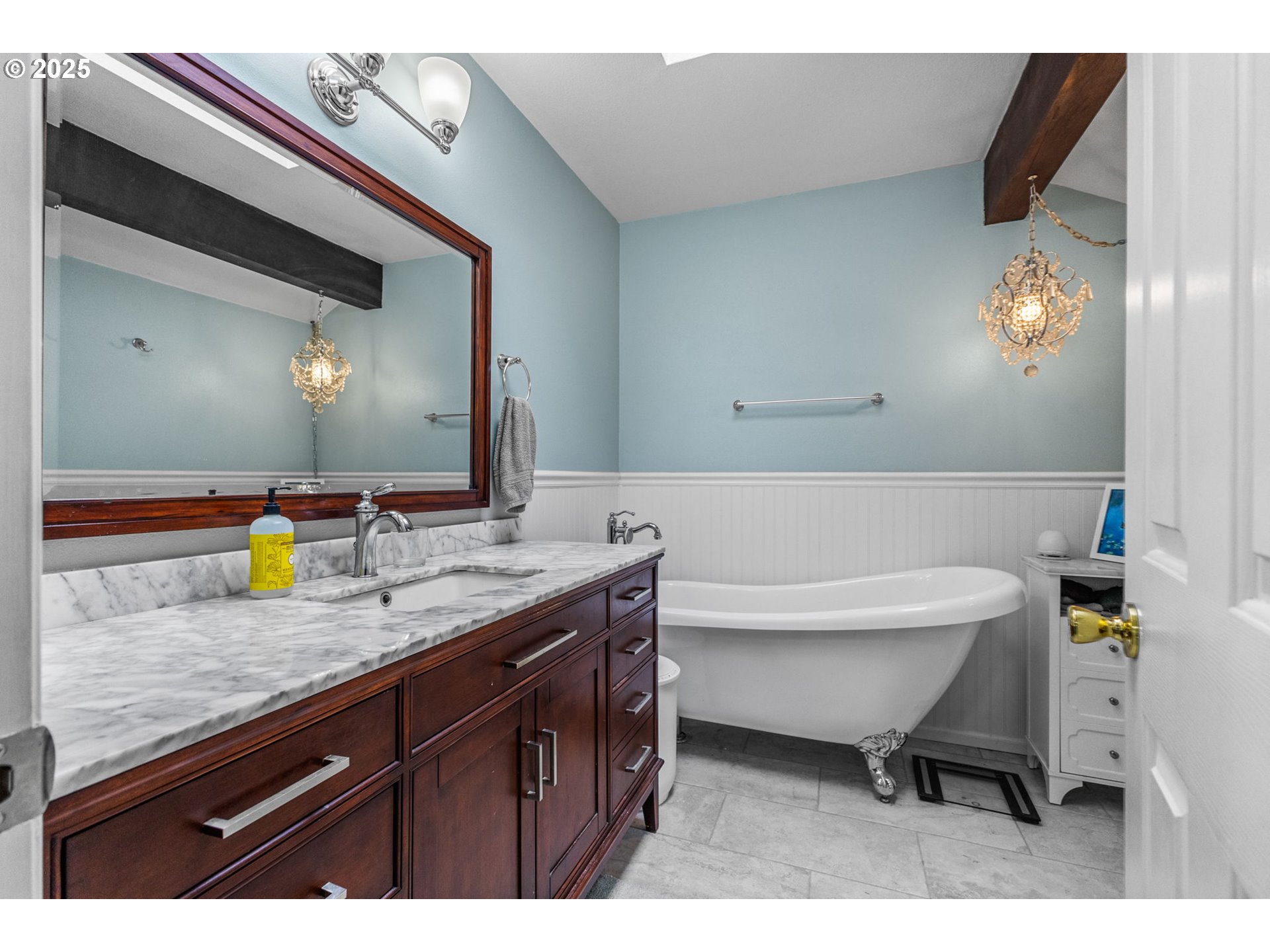 17576 North Abiqua Road Silverton, OR 97381 - Photo 22 of 40 a bathroom with a granite countertop sink a mirror and a toilet