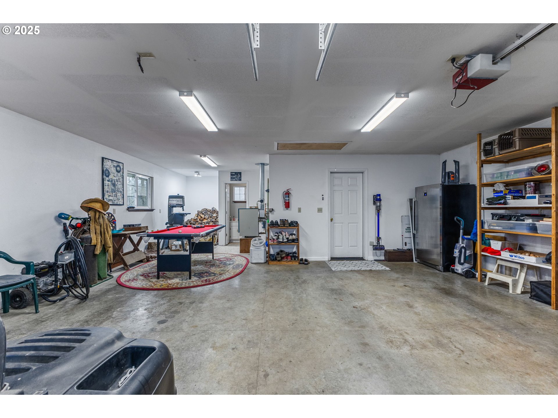 17576 North Abiqua Road Silverton, OR 97381 - Photo 24 of 40 a living room with lots of furniture and gym equipment
