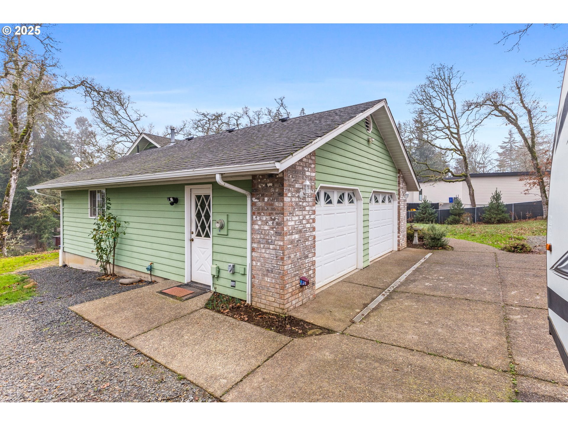 17576 North Abiqua Road Silverton, OR 97381 - Photo 29 of 40 a front view of a house with a yard and garage