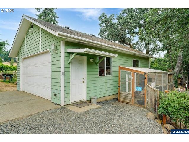 17576 North Abiqua Road Silverton, OR 97381 - Photo 39 of 40 a view of a small house with a backyard space