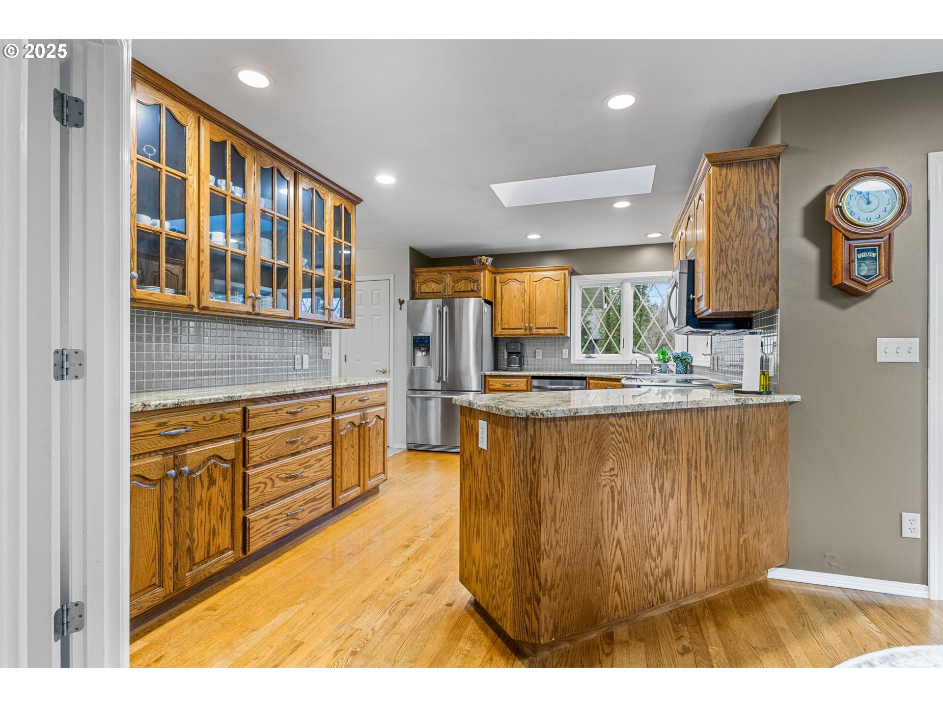 17576 North Abiqua Road Silverton, OR 97381 - Photo 4 of 40 a kitchen with stainless steel appliances granite countertop a sink and cabinets