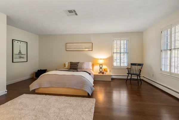 a bedroom with bed and window