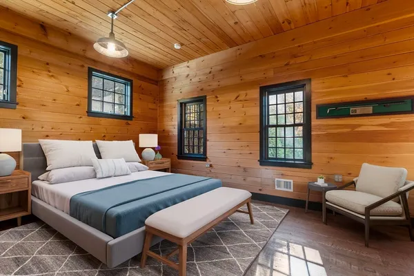 a bedroom with a bed and a couch