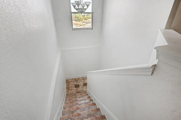 a view of a hallway with windows