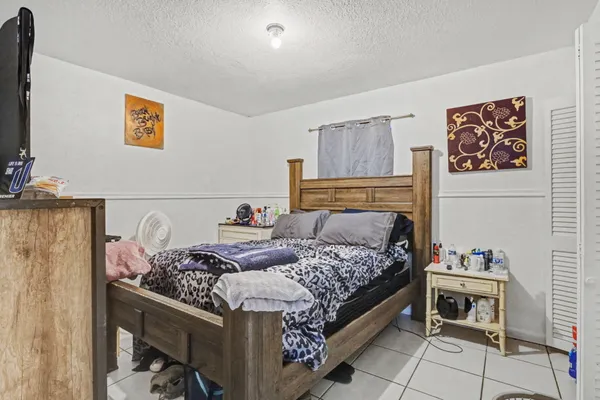 a bedroom with a bed and furniture