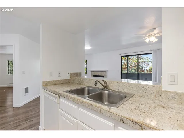 a kitchen with a sink and a window