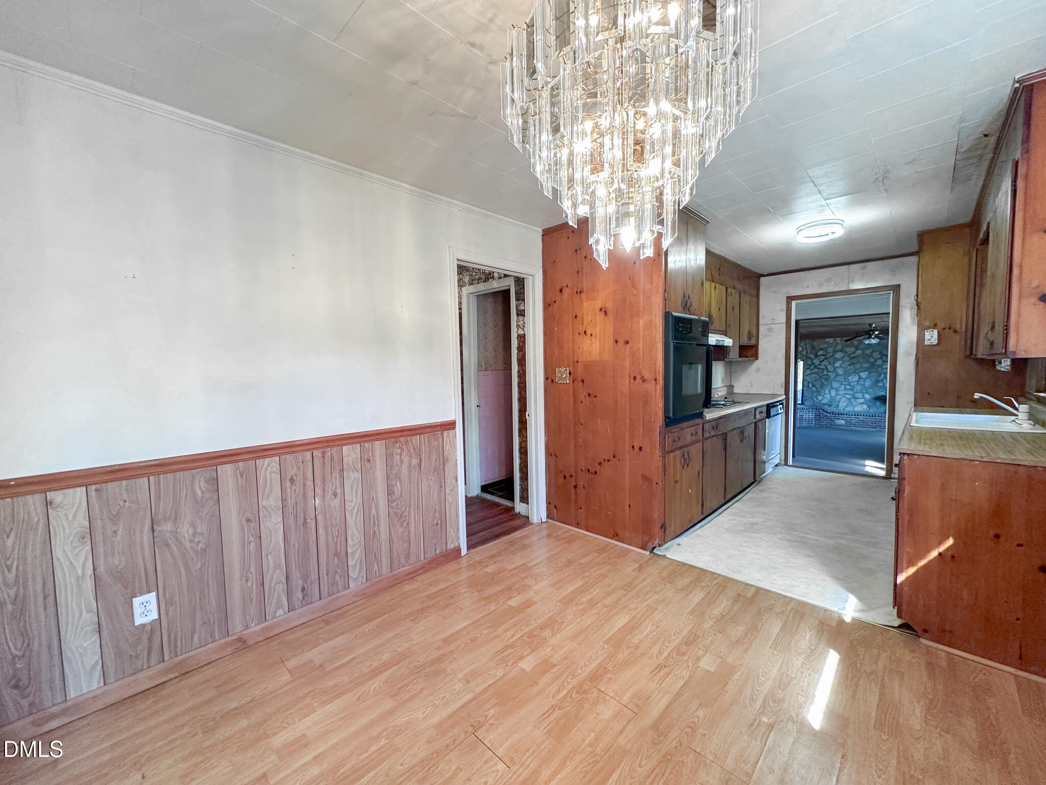 188 Jones Chapel Road Norlina, NC 27563 - Photo 20 of 71 a view of a hallway with wooden floor and a kitchen view