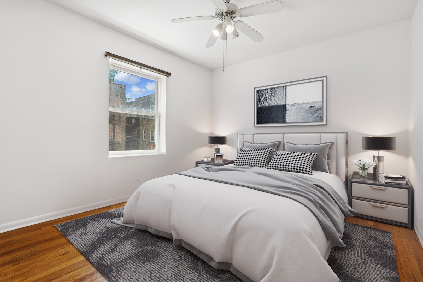 4915 North Avers Avenue, Unit 2CS Chicago, IL 60625 - Photo 13 of 18 a bedroom with bed and a window