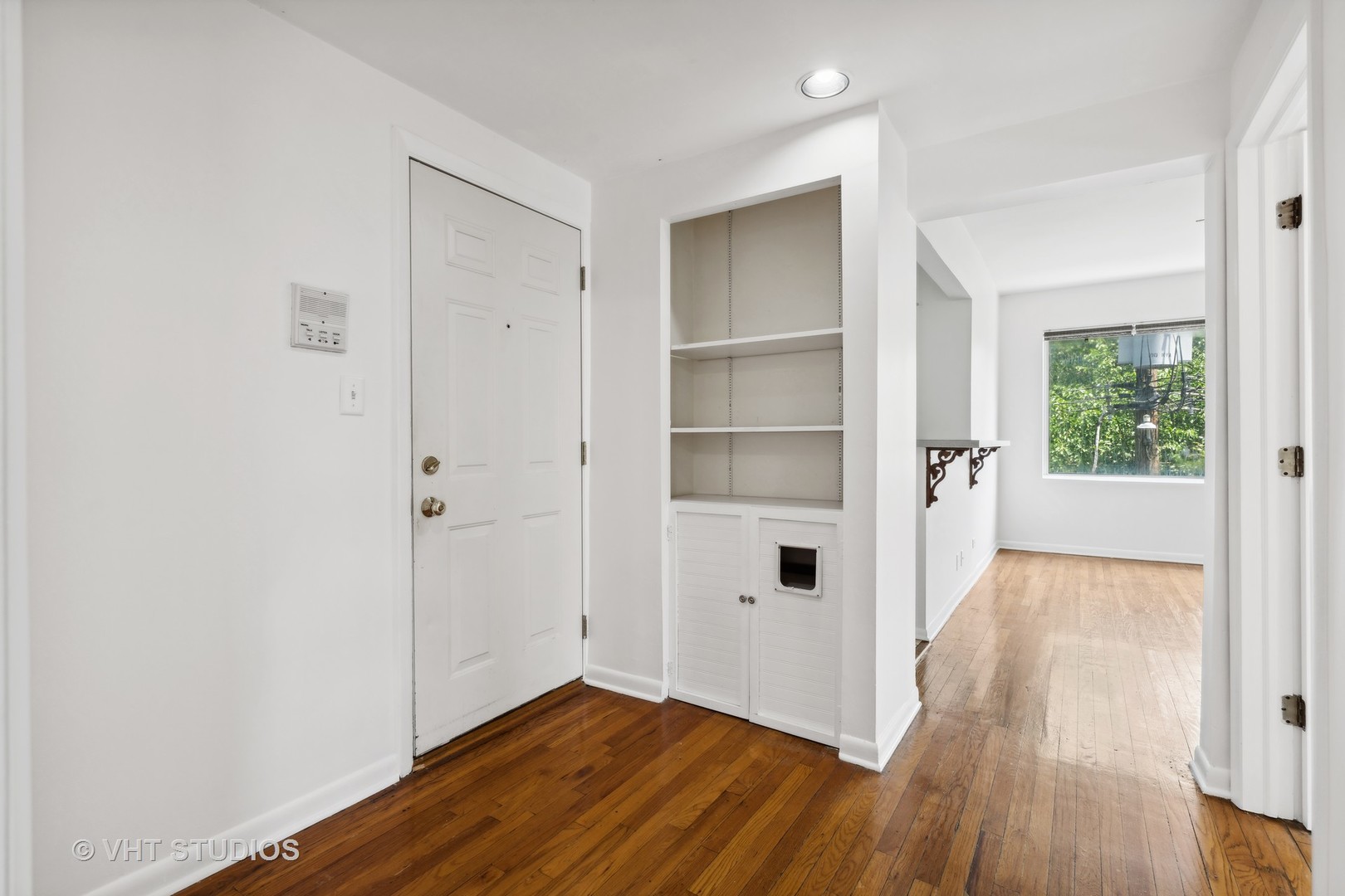 4915 North Avers Avenue, Unit 2CS Chicago, IL 60625 - Photo 3 of 18 a view of a room with wooden floor and windows