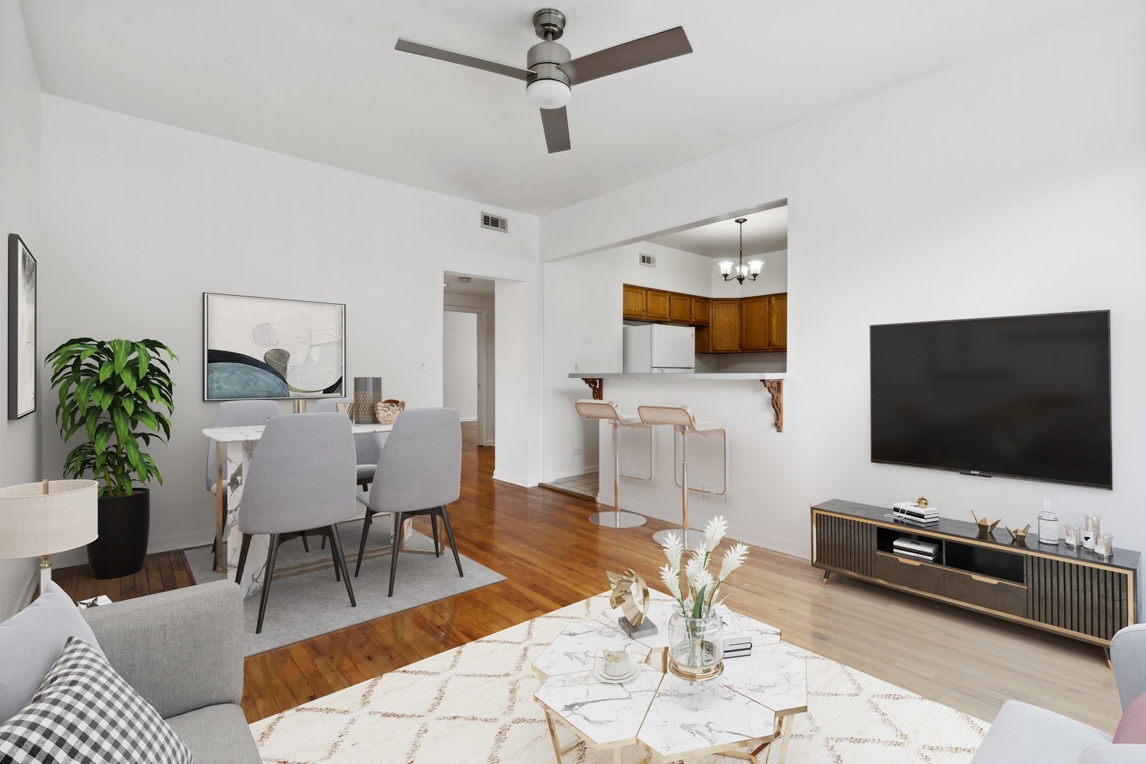 4915 North Avers Avenue, Unit 2CS Chicago, IL 60625 - Photo 7 of 18 a living room with furniture and a flat screen tv