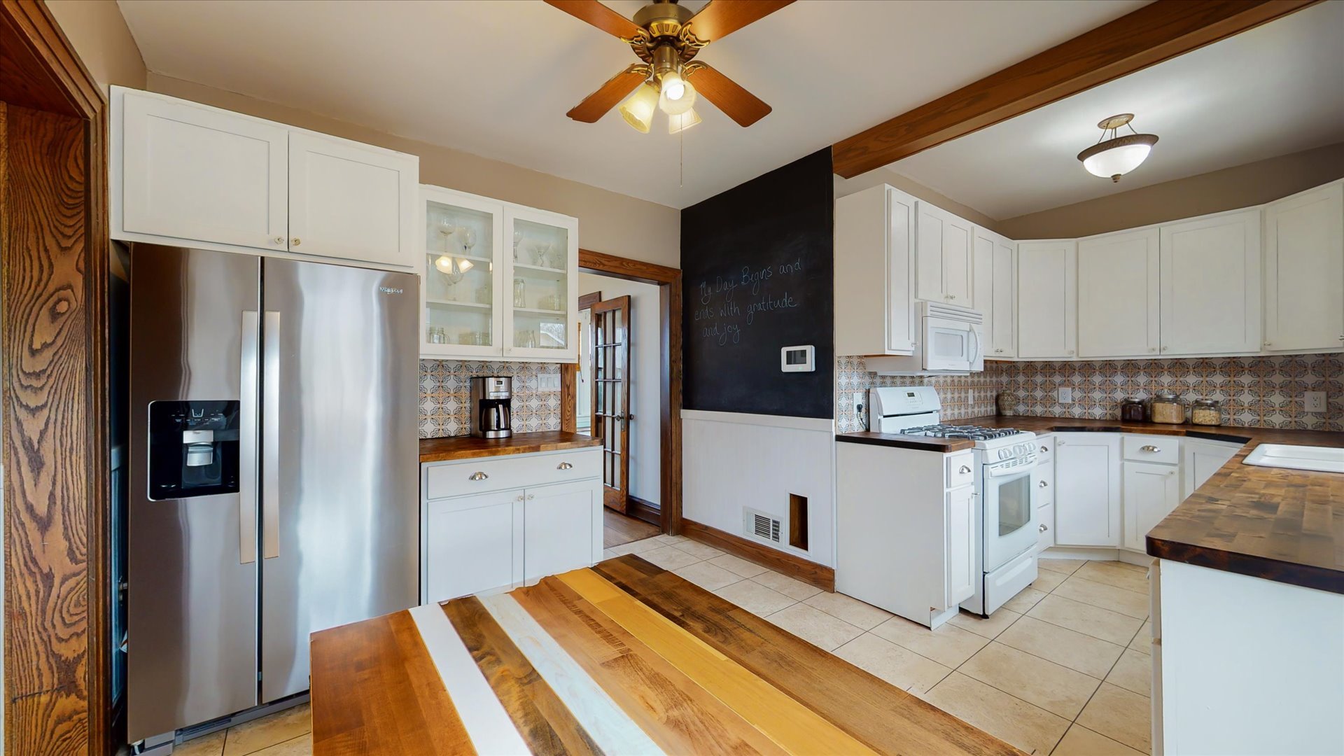 506 North Edwin Street Champaign, IL 61821 - Photo 15 of 45 a kitchen with stainless steel appliances a refrigerator sink and microwave