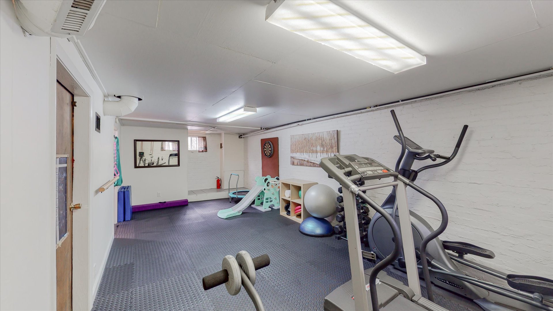 506 North Edwin Street Champaign, IL 61821 - Photo 20 of 45 a view of a room with gym equipment