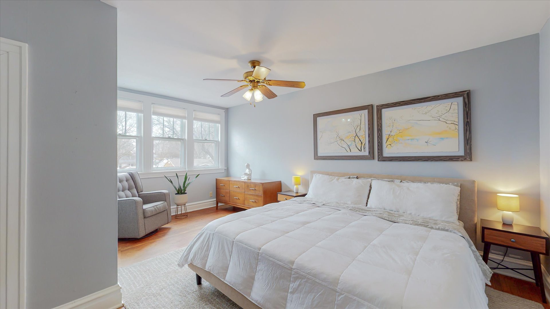 506 North Edwin Street Champaign, IL 61821 - Photo 31 of 45 a bedroom with a balcony a bed and a chandelier