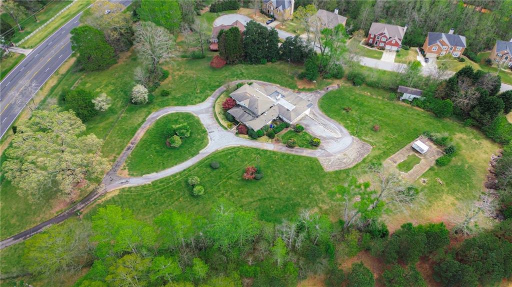 an aerial view of residential house with outdoor space and street view
