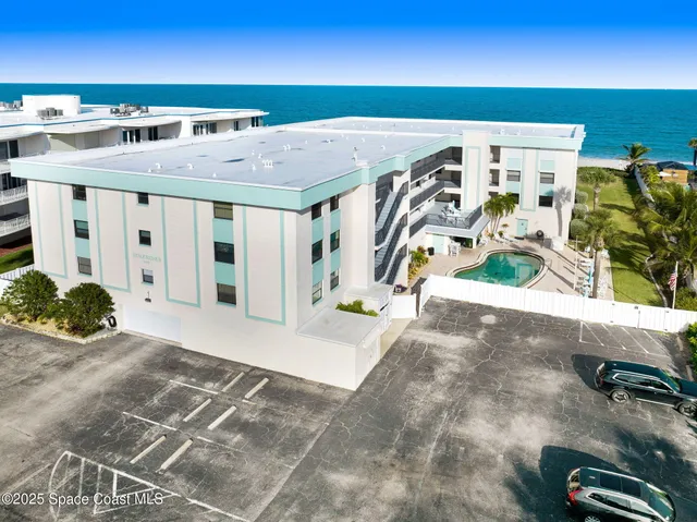 a view of a living room and entryway
