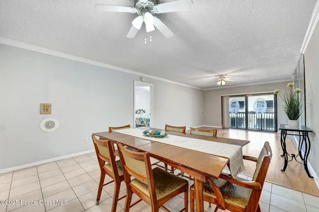 a view of a livingroom with furniture and a ceiling fan