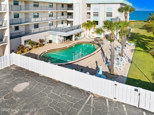 a view of a balcony with chairs