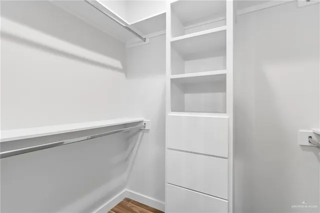 a view of an empty walk in closet