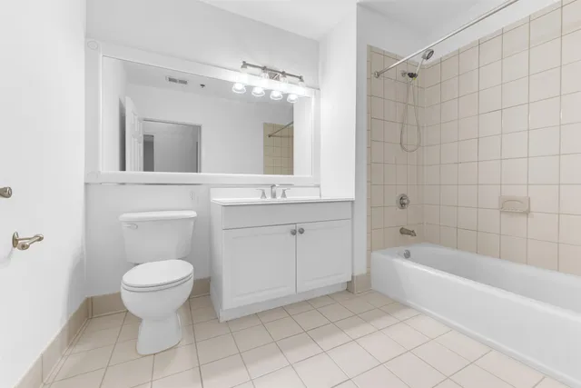 a bathroom with a sink a toilet and bathtub