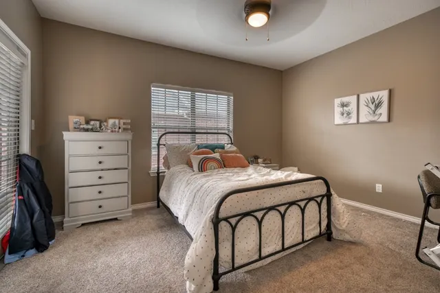 a bedroom with a bed and a closet