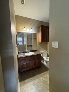 a view of an empty room with closet area