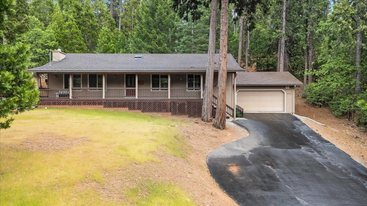24195 Awahanee Road Sonora, CA 95370 - Photo 1 of 1 a front view of a house with a yard