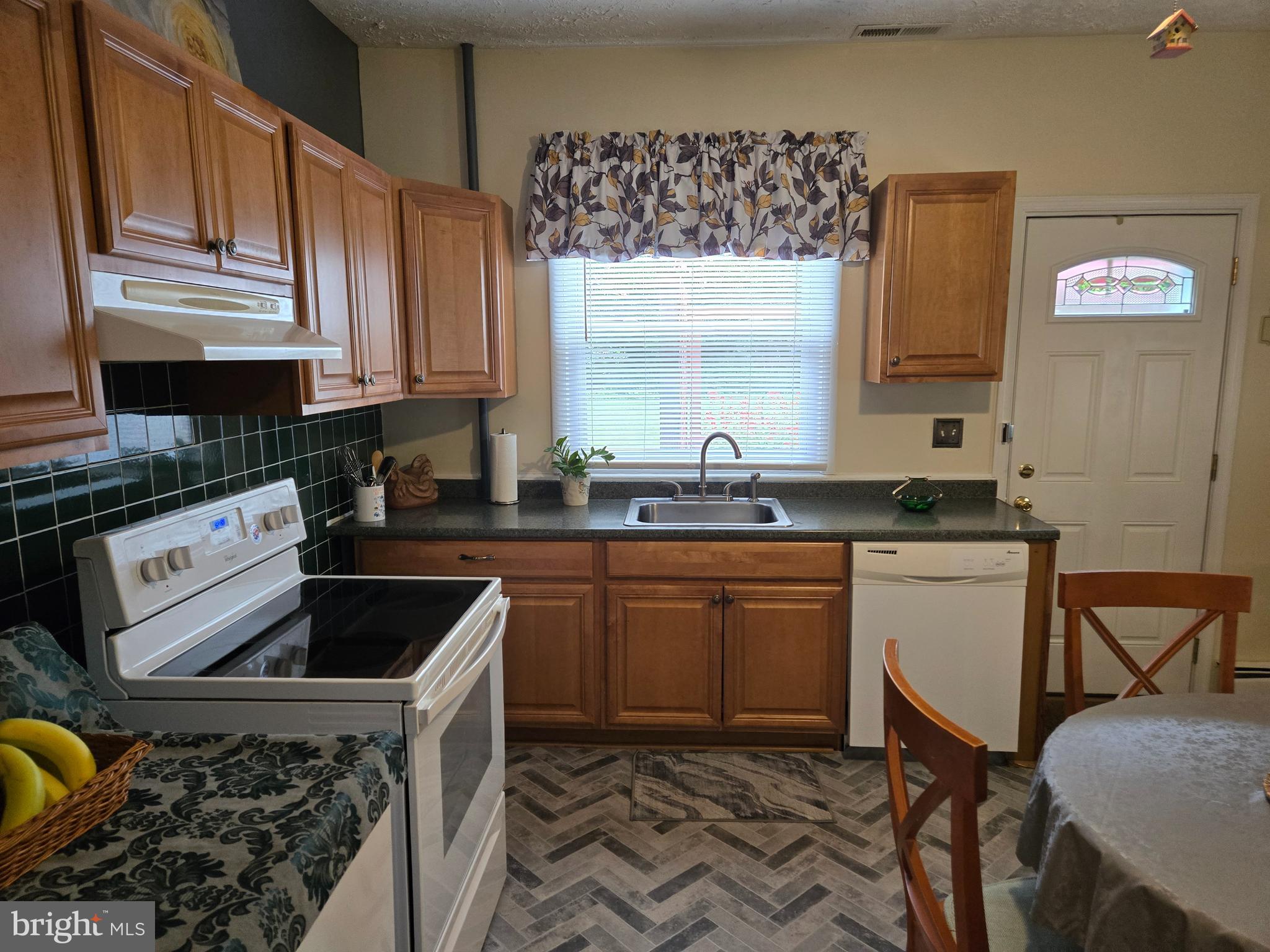 2414 Willoughby Beach Road Edgewood, MD 21040 - Photo 14 of 35 a kitchen with a sink stove and cabinets