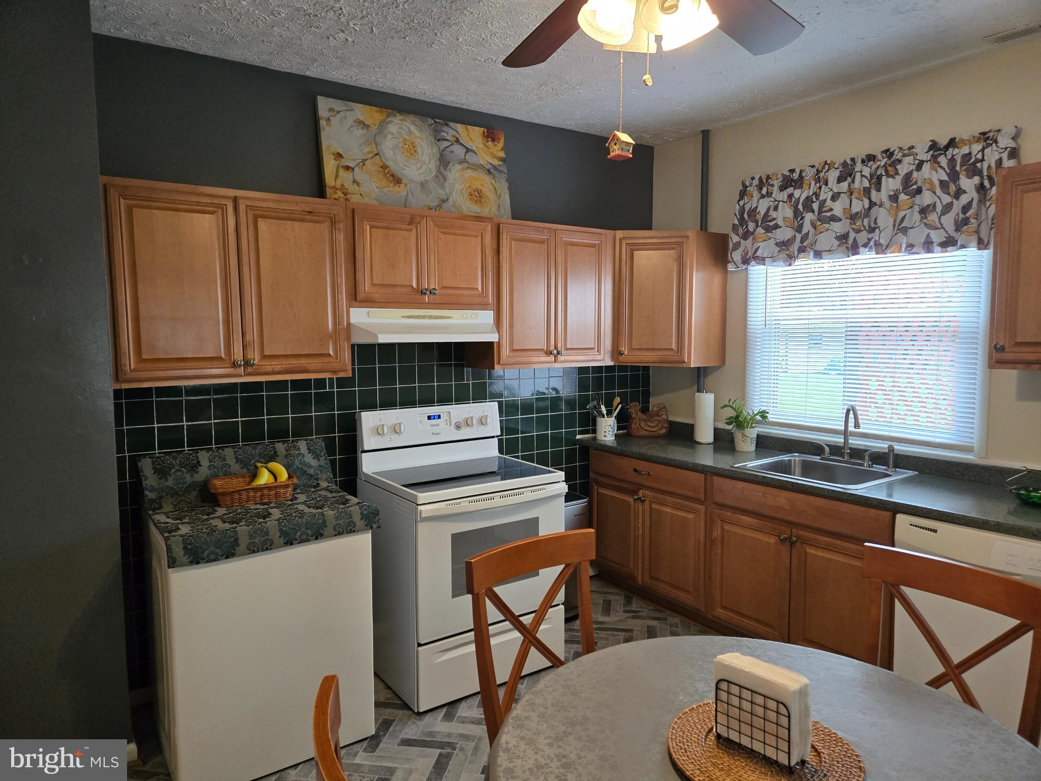 2414 Willoughby Beach Road Edgewood, MD 21040 - Photo 17 of 35 a kitchen with a stove a refrigerator and cabinets