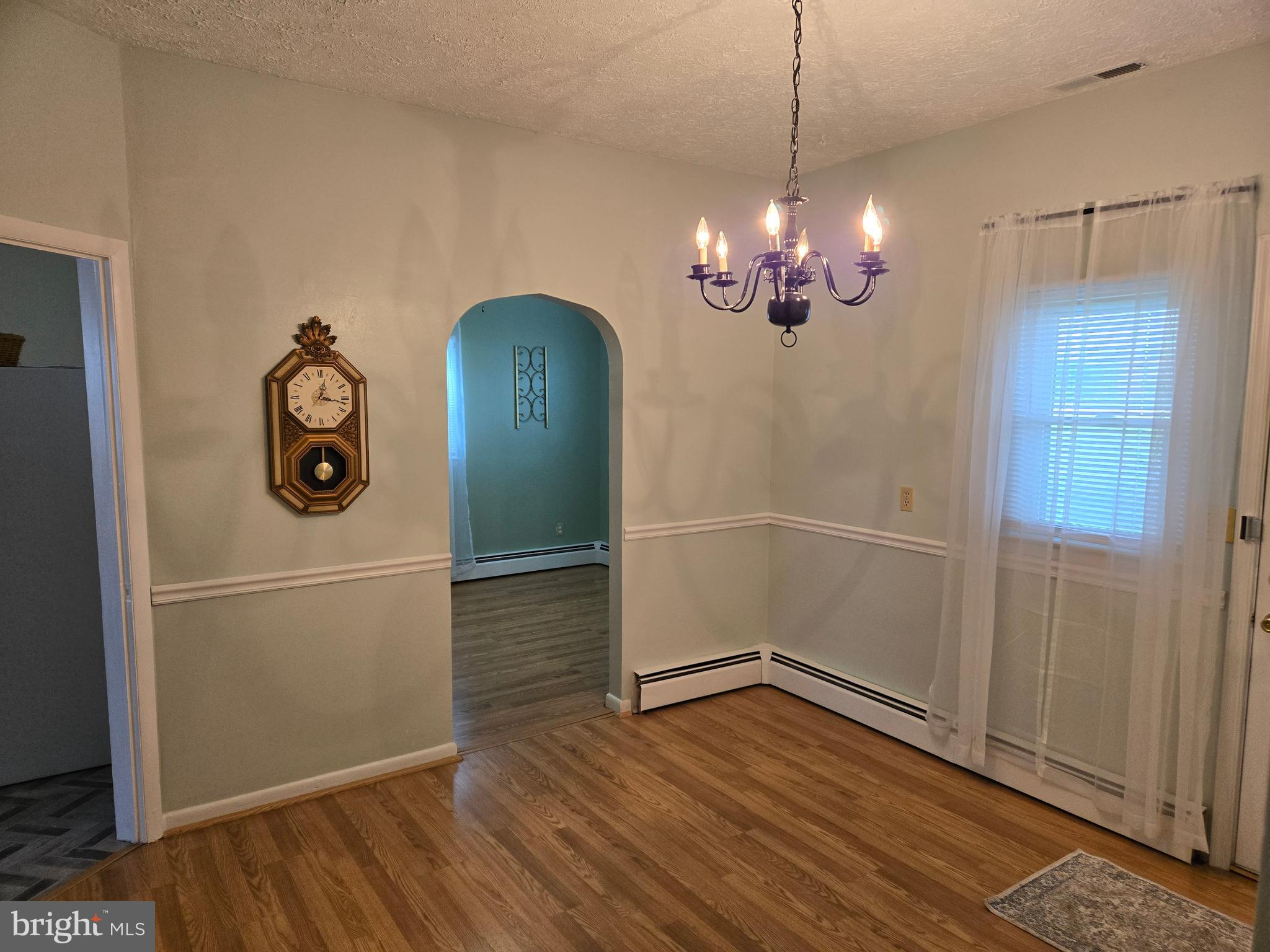 2414 Willoughby Beach Road Edgewood, MD 21040 - Photo 20 of 35 a view of a room with wooden floor chandelier and closet
