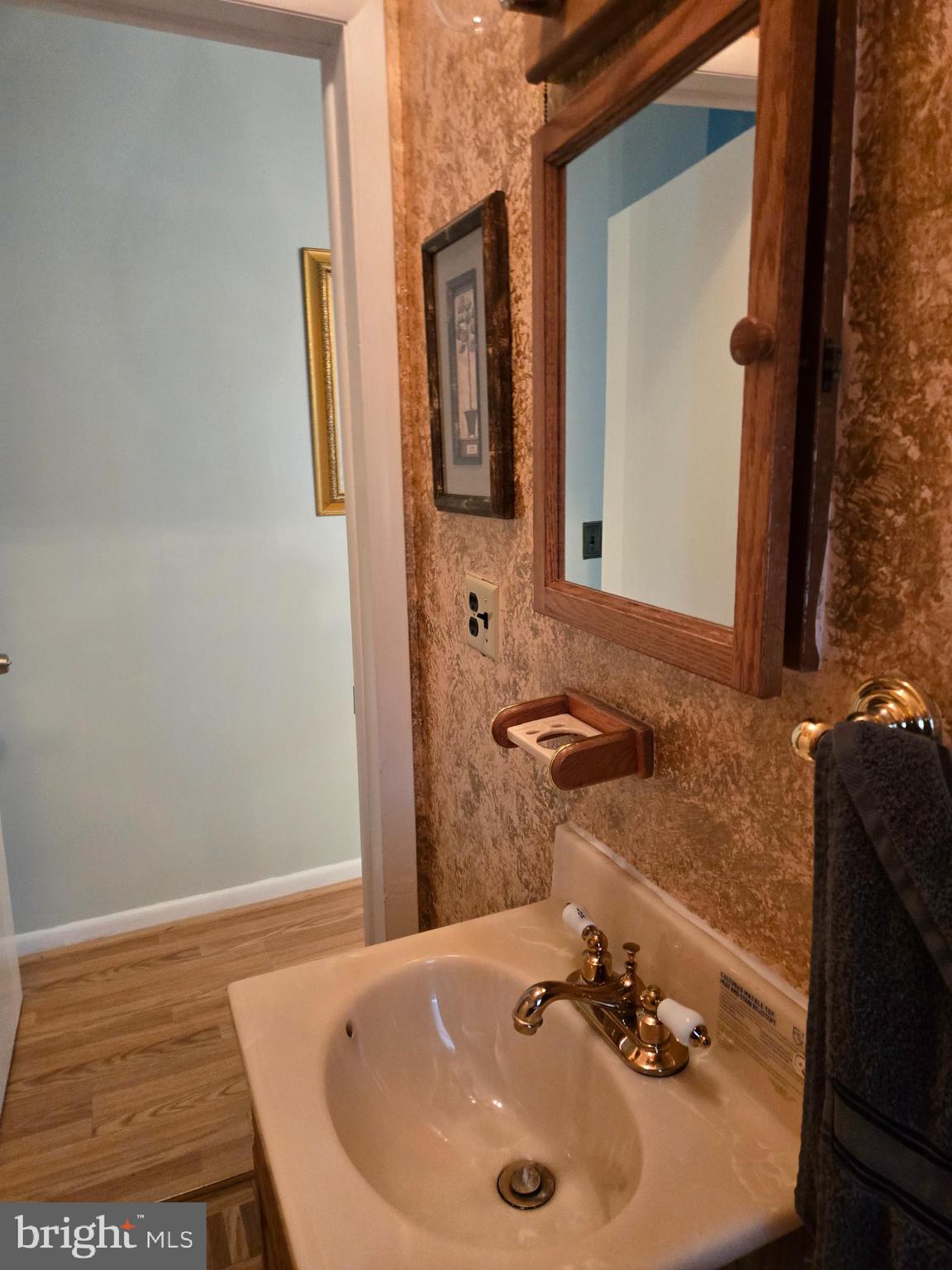 2414 Willoughby Beach Road Edgewood, MD 21040 - Photo 24 of 35 a bathroom with a sink and a mirror