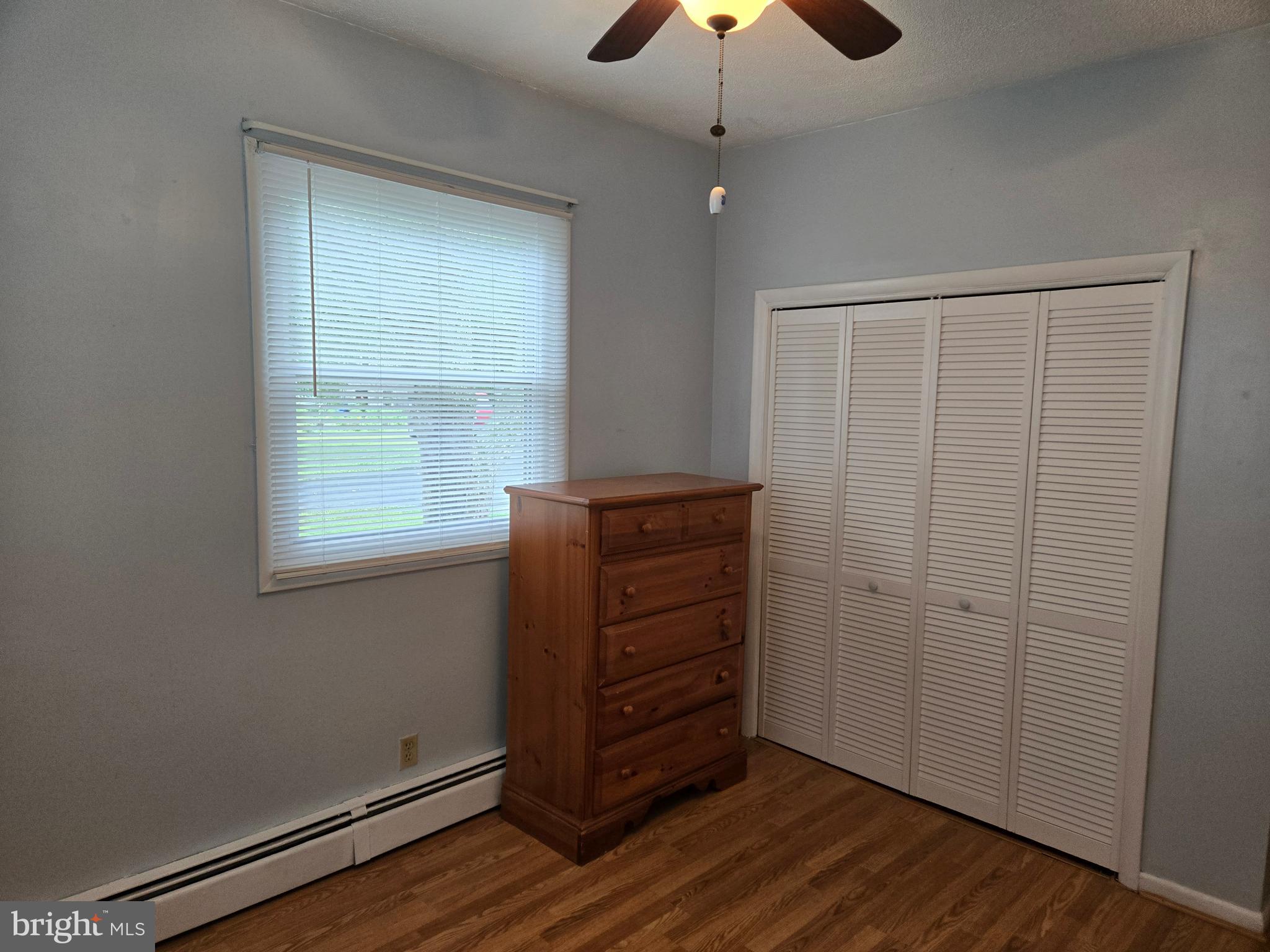 2414 Willoughby Beach Road Edgewood, MD 21040 - Photo 27 of 35 an empty room with wooden floor closet and windows