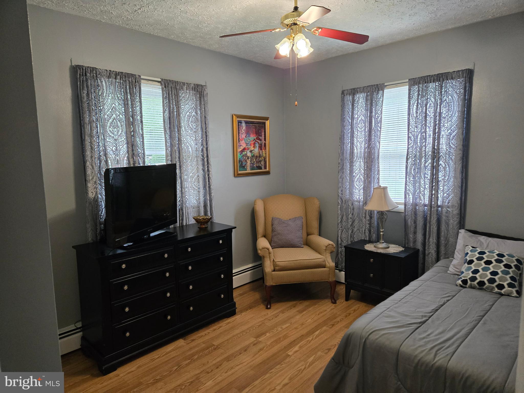 2414 Willoughby Beach Road Edgewood, MD 21040 - Photo 30 of 35 a bedroom with a bed and a flat screen tv