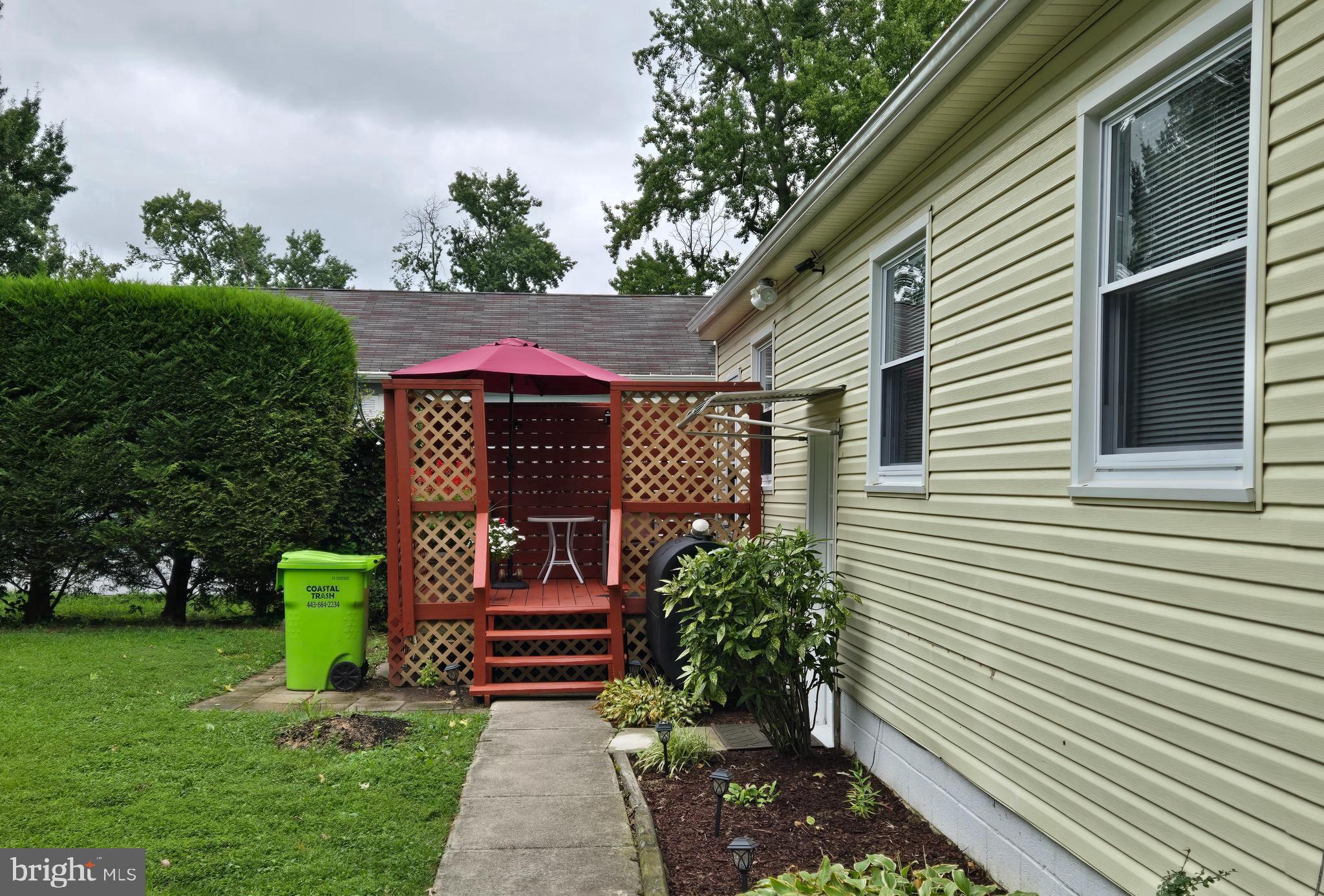 2414 Willoughby Beach Road Edgewood, MD 21040 - Photo 3 of 35 a view of a house with a small yard plants and large tree